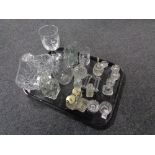 A tray containing antique and later glassware to include salts, cruets,