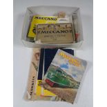 A box containing vintage Meccano magazines.