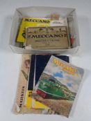 A box containing vintage Meccano magazines.