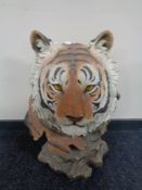 A large composite figure of a tiger's head.
