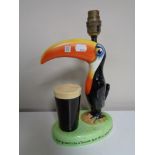 A Carlton ware Guinness 'How Grand to be a Toucan: Just think what toucan do' table lamp (AF).