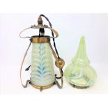 An Art Nouveau brass and vaseline glass light shade in the manner of WAS Benson, circa 1900,