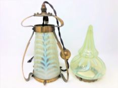 An Art Nouveau brass and vaseline glass light shade in the manner of WAS Benson, circa 1900,