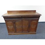 An Edwardian single door sideboard fitted with two drawers above.