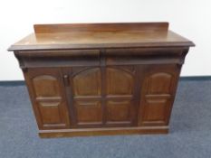 An Edwardian single door sideboard fitted with two drawers above.