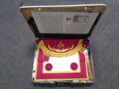 A Revelation case containing Free Masons regalia including sashes and robes