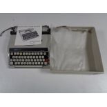 A cased Boots PT800 portable typewriter with original instructions.