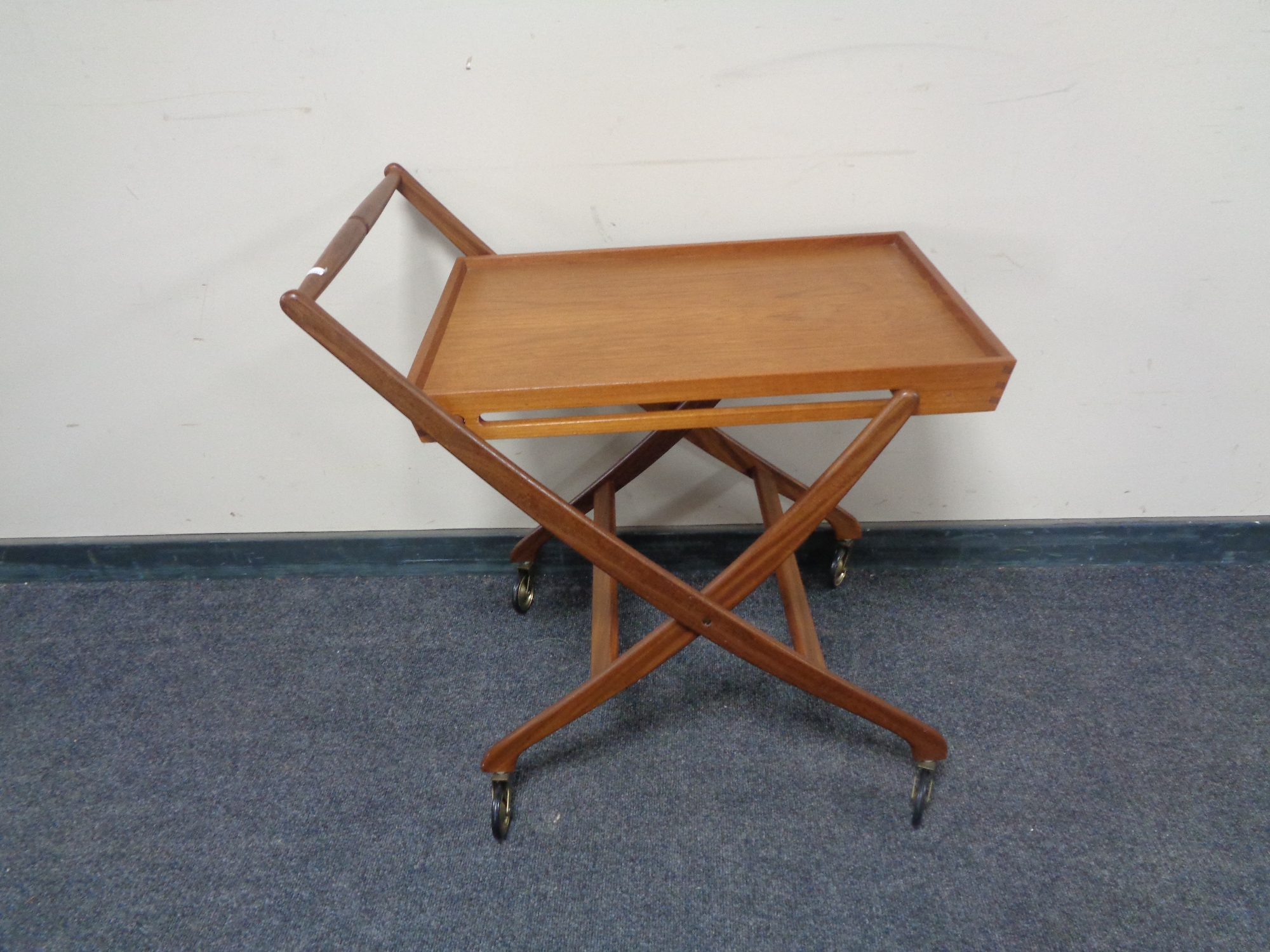 A mid 20th century teak folding tea trolley.