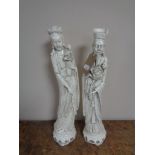 A pair of Eastern chalk figures.