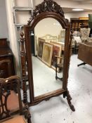 A reproduction mahogany Victorian style cheval mirror