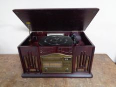 A reproduction turntable in traditional style with DVD player.