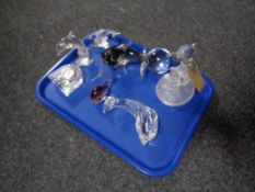 A tray containing Waterford Crystal clock, dolphin ornaments, glass paperweight etc.