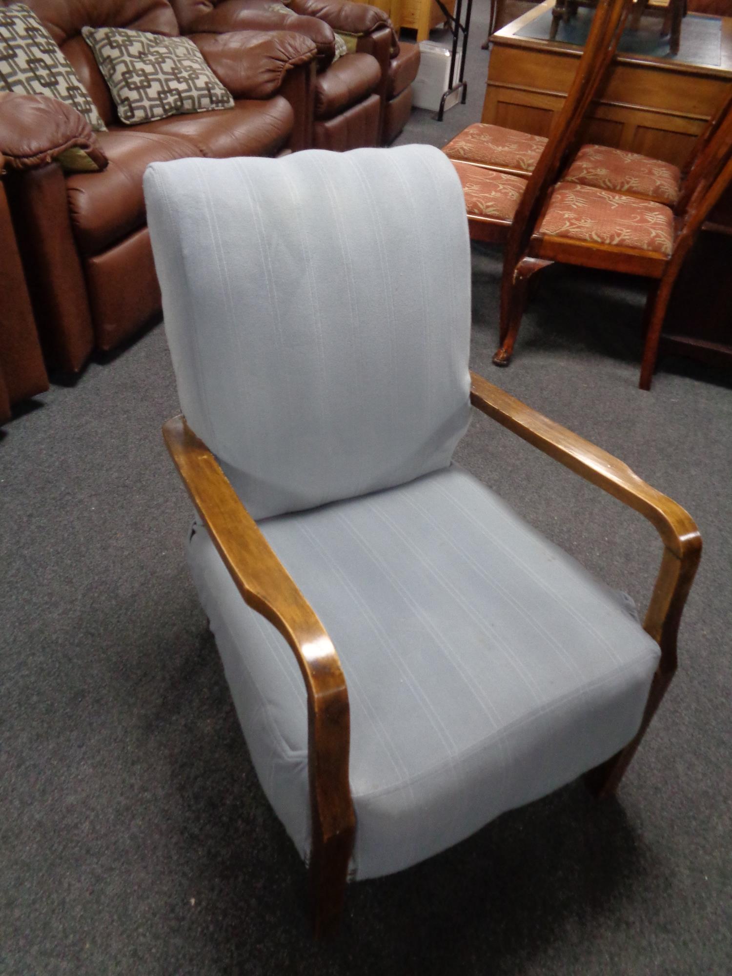 A mid 20th century beech framed armchair.
