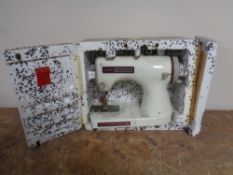 A Jones Meccano child's sewing machine in a polystyrene box.