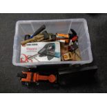 A box containing cased tools, trolley jacks, hand tools, battery charger etc.