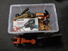 A box containing cased tools, trolley jacks, hand tools, battery charger etc.