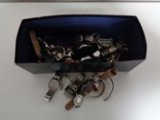 A box containing a collection of assorted ladies and gents wristwatches.