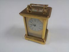 A brass cased thirteen jewel carriage clock by Richard & Cie