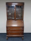 An Edwardian oak bureau bookcase.