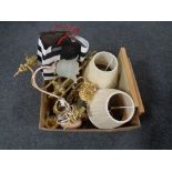 A box containing framed prints, leather bag, brass table lamps with shades,