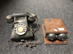 A vintage black Bakelite telephone together with a bell box.