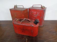 Three vintage oil cans.