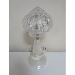 A 20th century cut glass table lamp with shade.