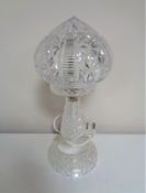 A 20th century cut glass table lamp with shade.