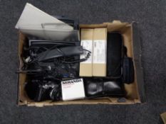 A box containing Olympus camera, Miranda lens, with other further cameras, an NEC fax machine etc,