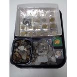 A tray containing a large quantity of assorted foreign coinage, pre decimal coins, half crowns etc.