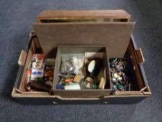 A box containing haberdashery items to include a large quantity of buttons, knitting needles etc.