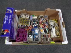 A box containing haberdashery items to include threads, scissors, cord, Remington iron etc.