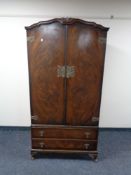 A 20th century Queen Anne style gentleman's wardrobe together with kneehole dressing table.