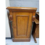 An antique oak Gothic style single door cupboard