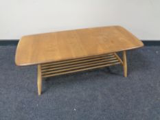 An ercol solid elm and beech coffee table with under shelf.