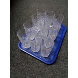 A tray of crystal tumblers.