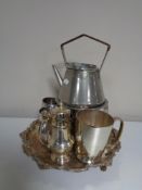 A shaped silver plated serving tray on pore feet together with further plated ware to include