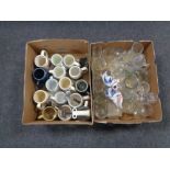 Two boxes containing ceramic and glass pub tankards, glass decanter, bottle openers etc.