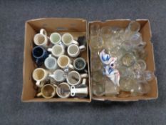 Two boxes containing ceramic and glass pub tankards, glass decanter, bottle openers etc.