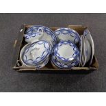 A box containing antique blue and white Empire dinner ware.