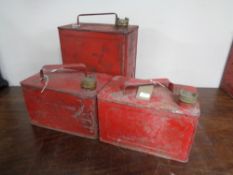 Three vintage oil cans.