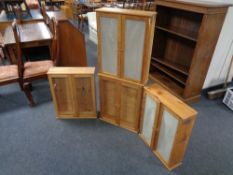 Four pine double door glazed wall cabinets.