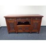 A late 19th century mahogany four door sideboard fitted with three drawers above,