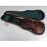 An early twentieth century violin and bow in coffin case