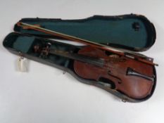 An early twentieth century violin and bow in coffin case