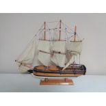 A wooden model of HMS Endeavour.