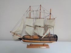 A wooden model of HMS Endeavour.