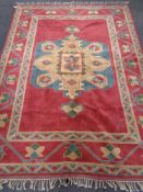 A fringed Caucasian rug,