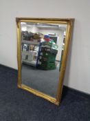 A gilt framed bevel edge overmantel mirror.