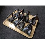 A tray of eight antique cast iron flat irons.
